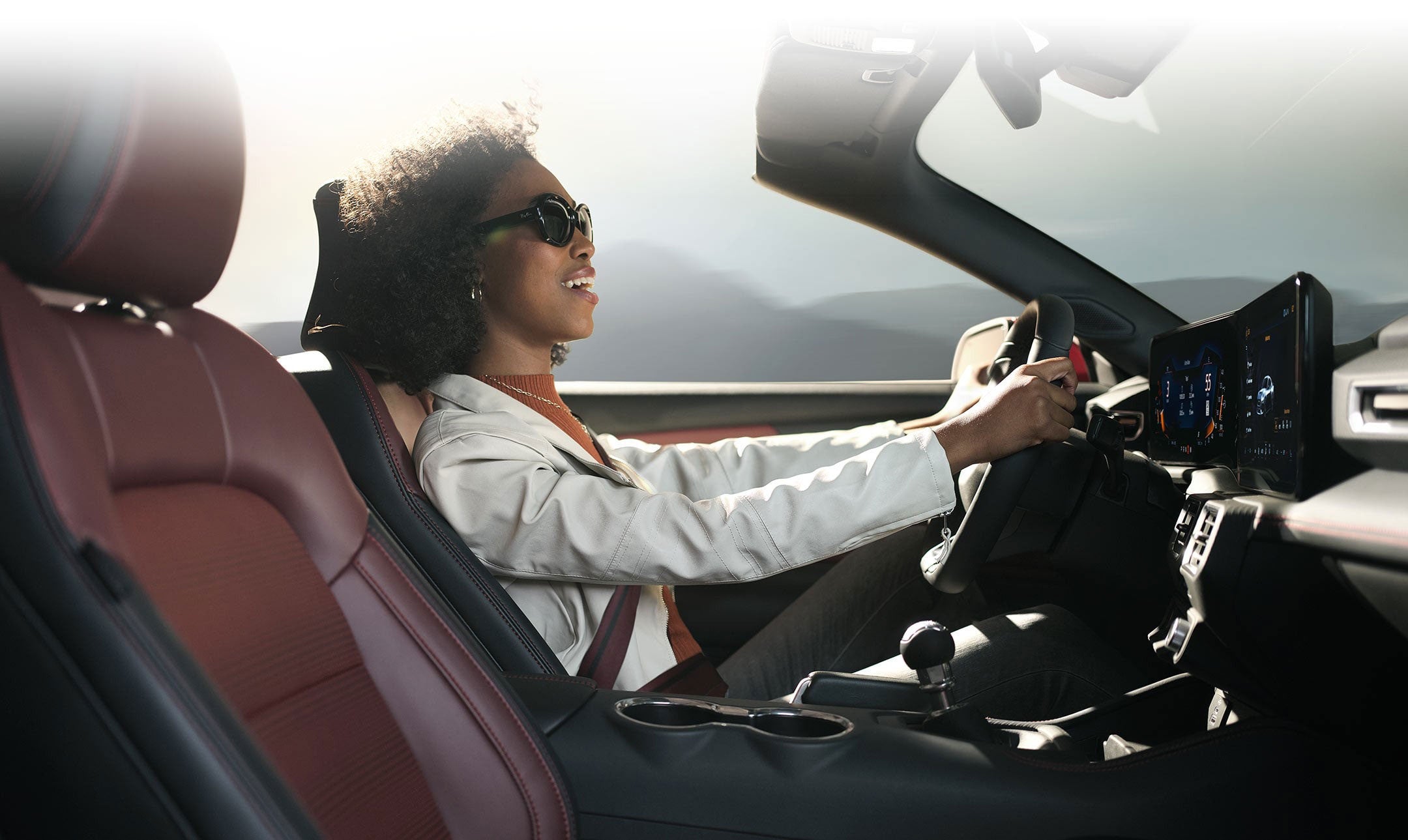 Person sitting in the driver’s seat of a 2024 Ford Mustang® convertible | Lilliston Ford Inc. in Vineland NJ